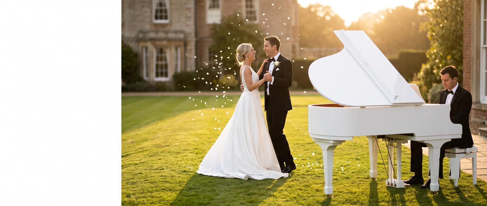 Bride and groom dance on a country house lawn at golden hour beside a white baby grand piano, played by a pianist in black tie
